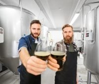 brewery owners holding beer glasses-brewery business plan