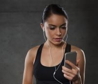 woman with smartphone using music app